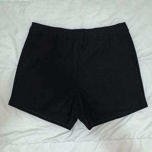 High waisted black shorts w zipper in the back.